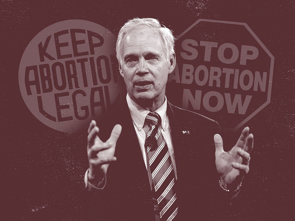 Ron Johnson beside signs saying "Keep abortion legal" and "Stop abortion now."