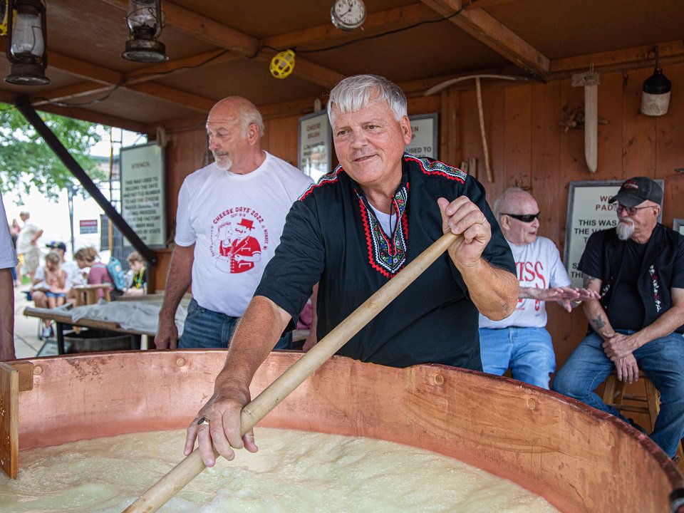 Cheesemaker Gary Grossen stirs the kettle during a past Green County Cheese Days.