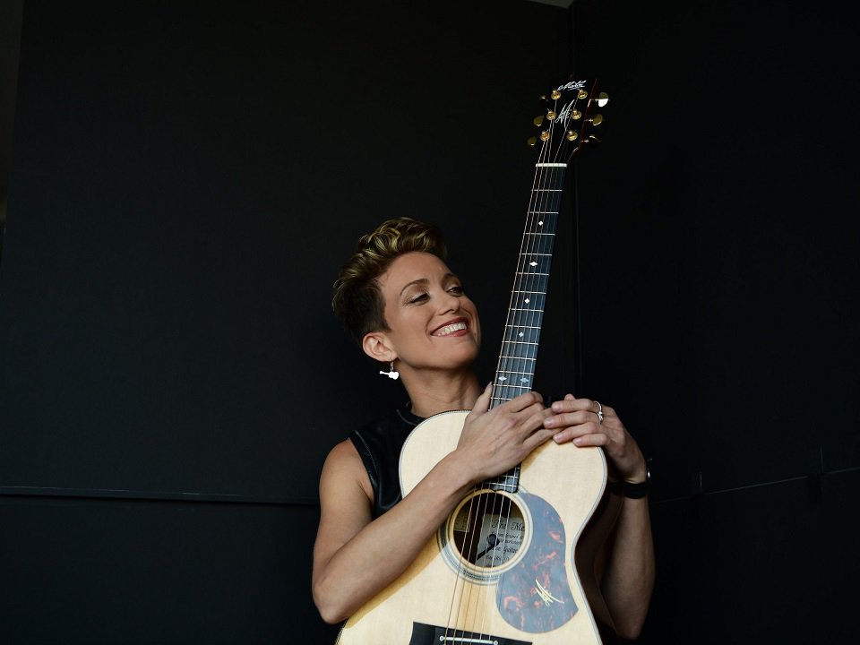 Christie Lenée and guitar.