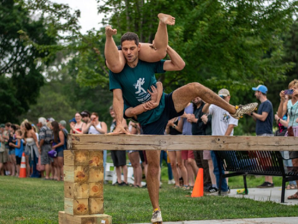 Competitors in the Wisconsin Wife Carry Championship at a past Monona Community Festival.