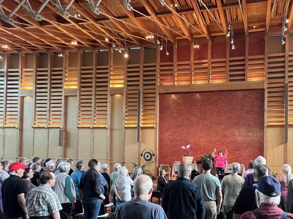 Madison Symphony Chorus director Beverly Taylor leads a group of singers at the 2023 Madison Sings!