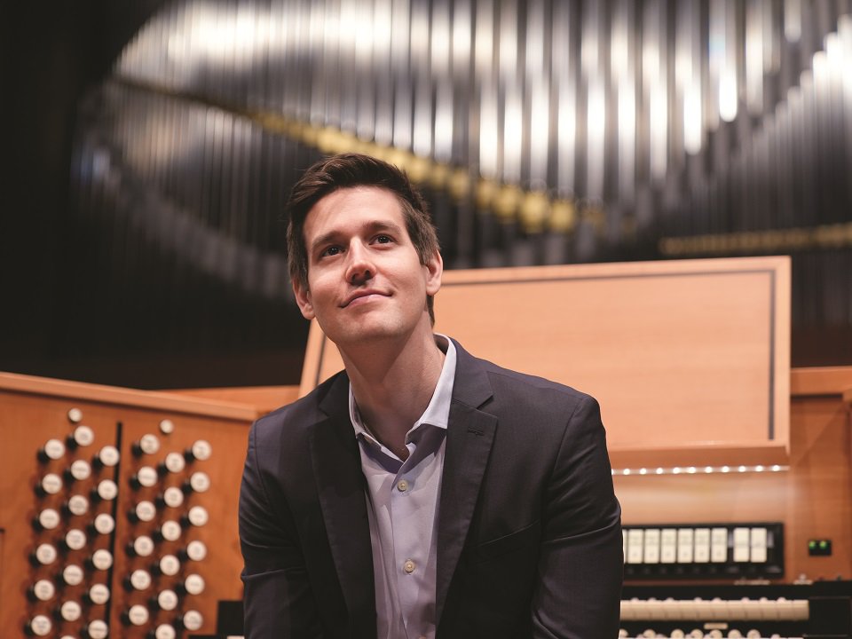 Greg Zelek sitting at the Overture Center concert organ.