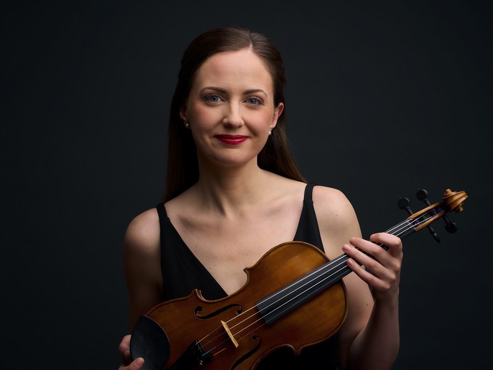 A close-up of Eleanor Bartsch and violin.