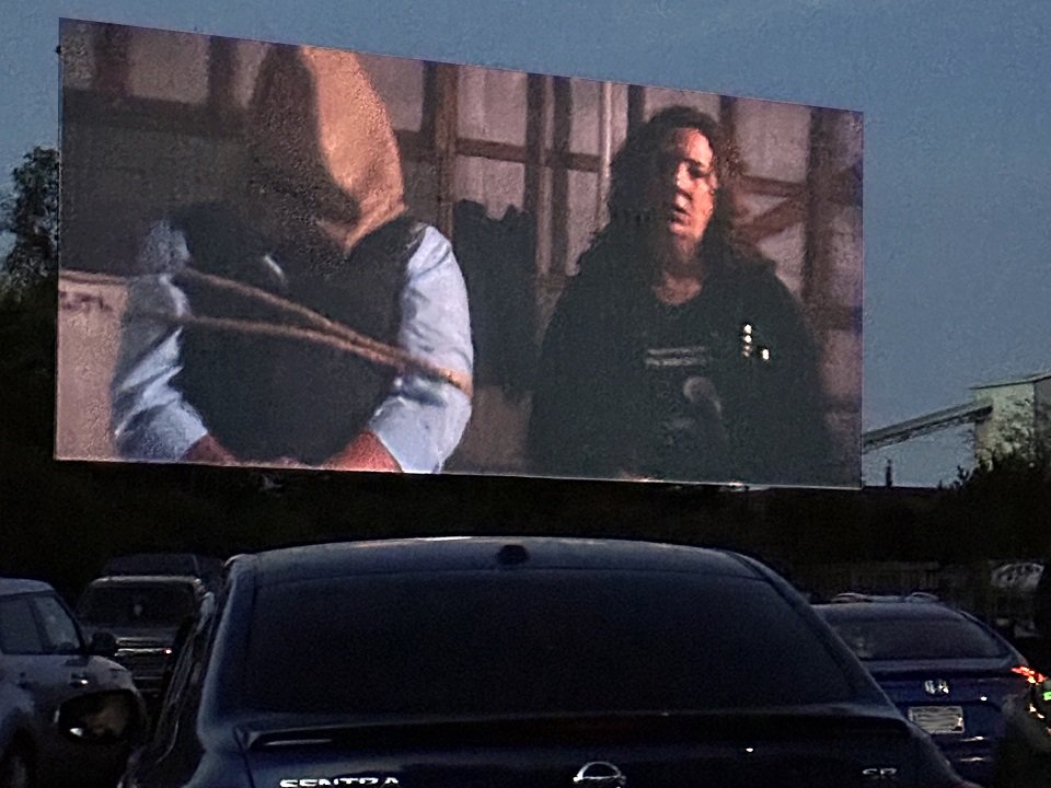 A film showing at a drive-in theater.