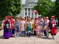 The Raging Grannies gather for a picture on the Capitol Square.