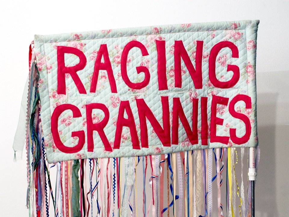 A Raging Grannies banner.