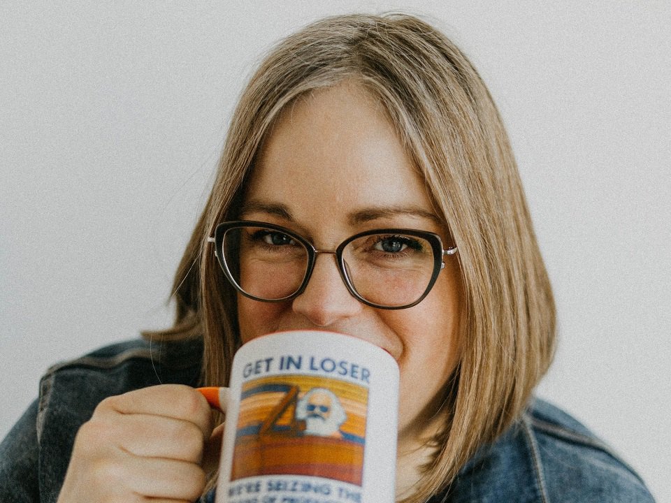 Kristin Lytie drinking from a mug.