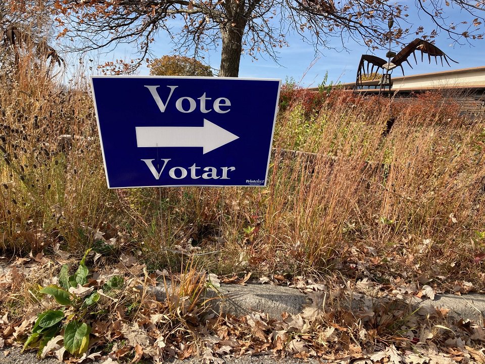 A sign pointing the direction to the polling place at Warner Park Community Recreation Center.