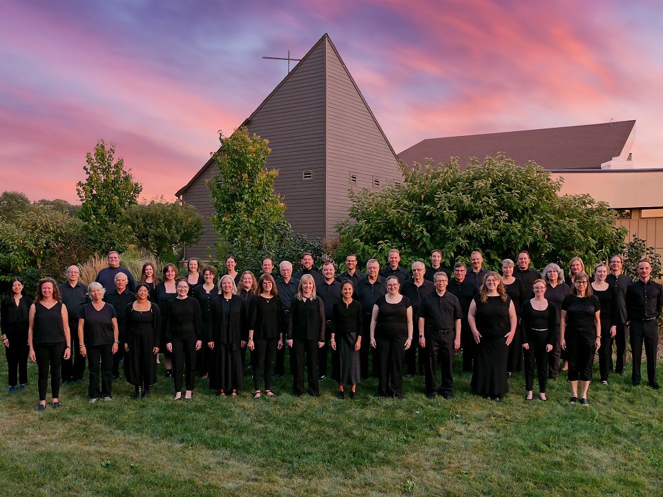 The members of the Wisconsin Chamber Choir and a colorful skyline.