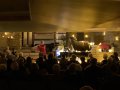 A flute and piano duo in a candlelit space.