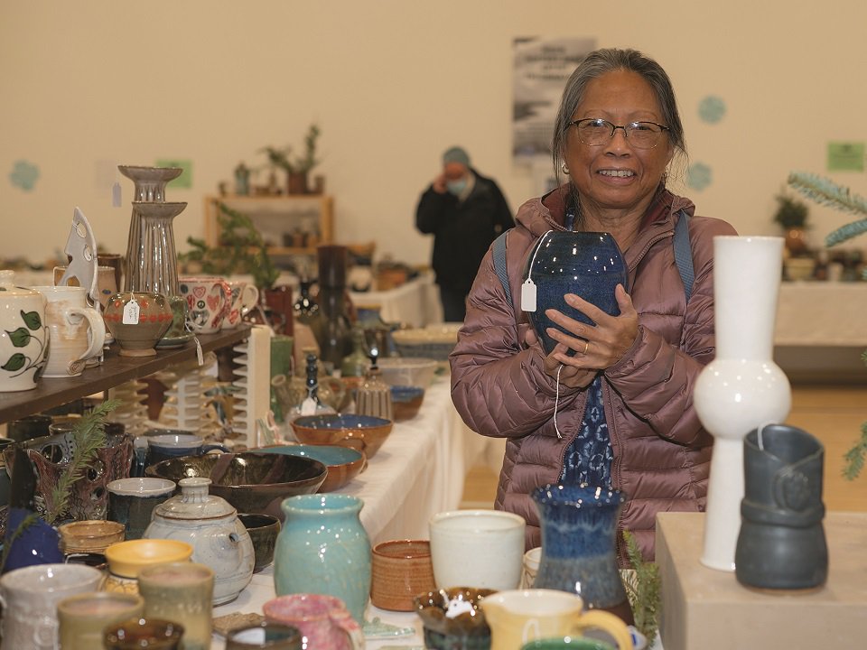 A shopper at a past MSCR Pottery Sale