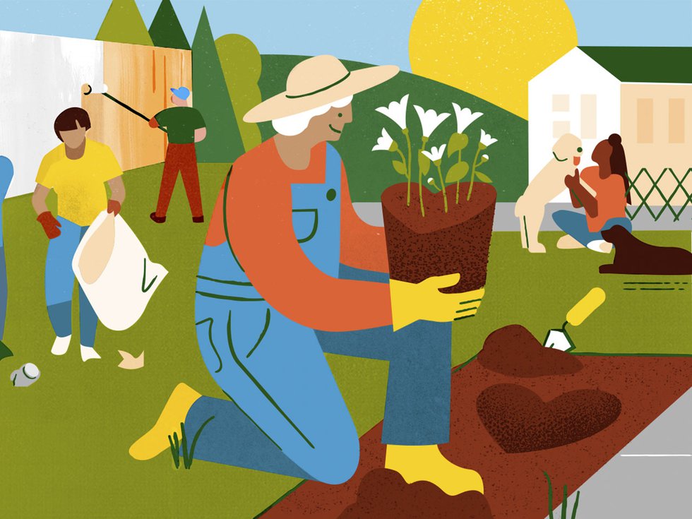 A woman plants a heart-shaped plant among other volunteers.