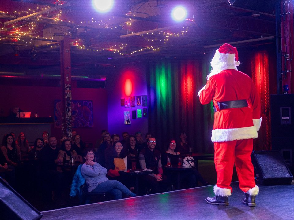 Connor O'Hara (as Santa Claus) faces an audience.