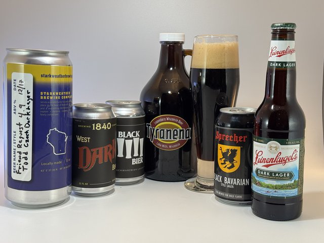 A lineup of local black lagers in cans, bottles and glasses.